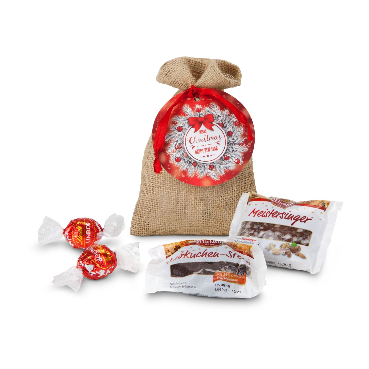 1 Oblaten-Lebkuchen (28 g, glasiert), 1 Lebkuchen-Stern (25 g, schokoliert) & 2 Lindorkugeln (je 12,5 g) verpackt im Jutesäckchen.