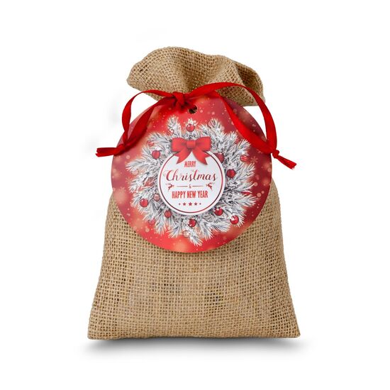 1 Oblaten-Lebkuchen (28 g, glasiert), 1 Lebkuchen-Stern (25 g, schokoliert) & 2 Lindorkugeln (je 12,5 g) verpackt im Jutesäckchen.