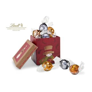 9 zartschmelzende Lindorkugeln (je 4x Zartbitter, Karamell & Haselnuss) im wunderschönen Schneemann-Geschenkkarton.