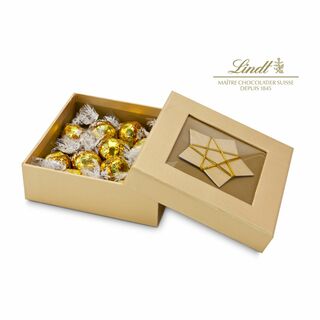 10 zartschmelzende weiße, gold-gewickelte Lindt-Kugeln in hochwertiger, goldener Schmuckschachtel mit Stern-Dekor. Frohe Weihnachtszeit.