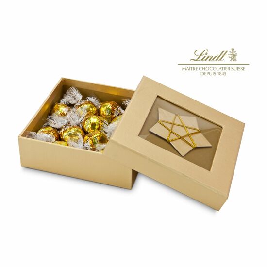 10 zartschmelzende weiße, gold-gewickelte Lindt-Kugeln in hochwertiger, goldener Schmuckschachtel mit Stern-Dekor. Frohe Weihnachtszeit.