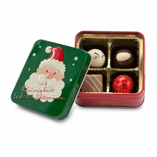 50 g Pralinen und Trüffel in einer schönen grün-roten Dose mit Weihnachtsmann-Motiv.