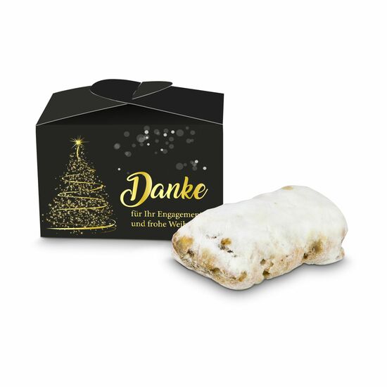 Ein 80 g Mini-Stollen in einer Pralinenverpackung mit „Danke und frohe Weihnachten” Aufdruck.