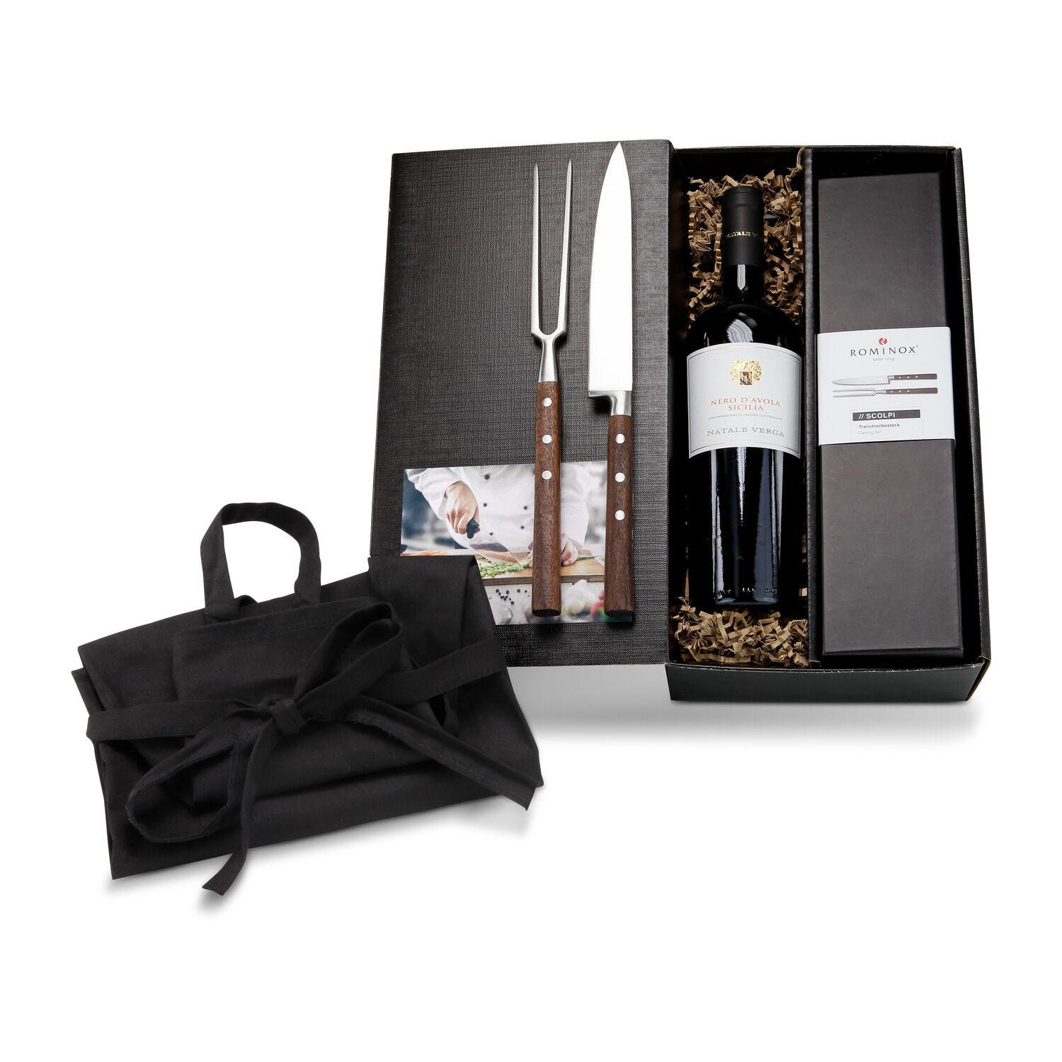 ROMINOX® Tranchierbesteck Scolpi, eine Flasche Nero d'Avola (0,75 l) und eine schwarze Küchenschürze verpackt im schwarzen Geschenkkarton.