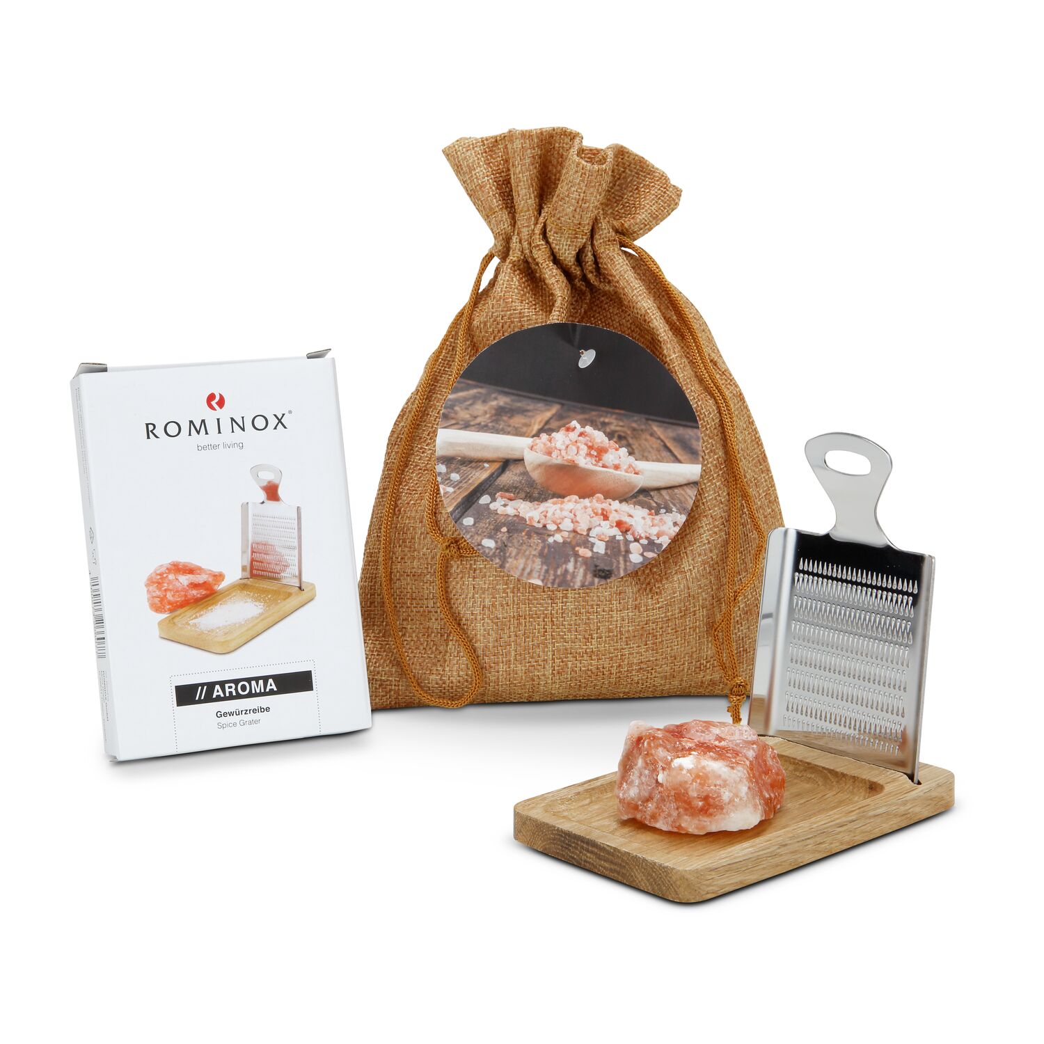 Sie erhalten die ROMINOX® Gewürzreibe Aroma mit Ständer und dazu rötliches Kristallsalz (Salzbrocken, ca. 50 g) im hellbraunen Jutesäckchen.